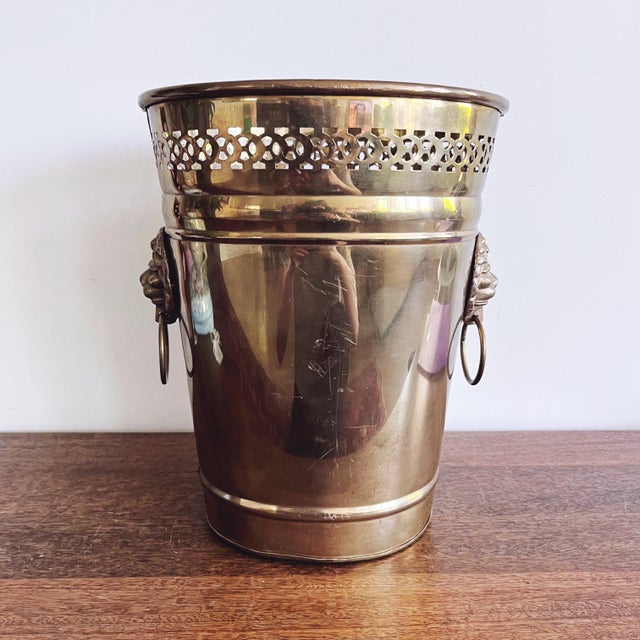 Vintage brass trash can with lion head handles. Overall lovely condition. 9.5” x 7.5” x 12”