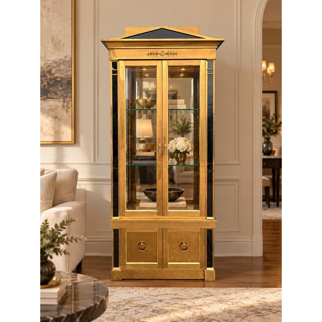 An exceptional circa 1970s Neoclassical display cabinet attributed to Mastercraft, featuring an impressive architectural...