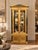 An exceptional circa 1970s Neoclassical display cabinet attributed to Mastercraft, featuring an impressive architectural...