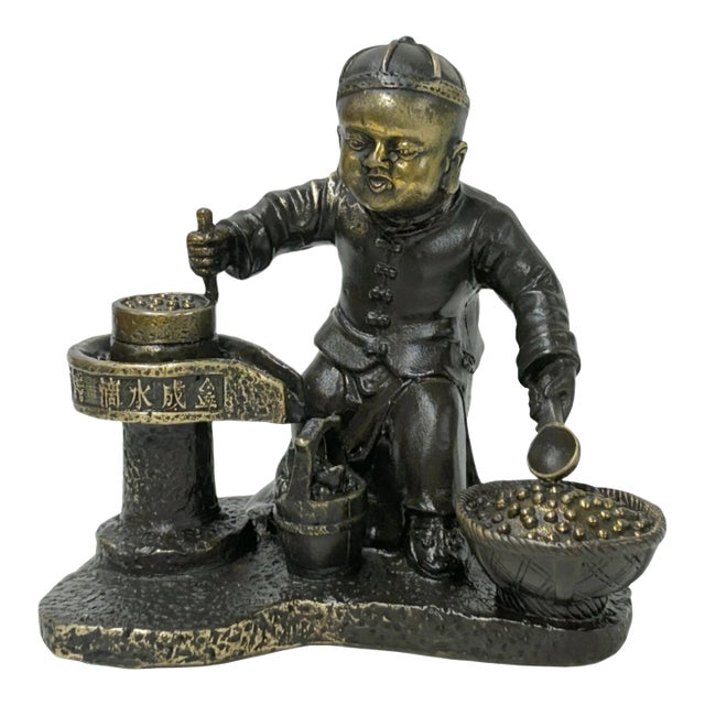 Vintage Bronze Color Metal Old Style Dressing Kid Grinding Pose Statue For Sale