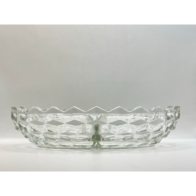 A geometric divided flat dish which is patterned with layers of cubes that catches both the eye and the light beautifully....