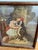 Charming antique/vintage framed color print titled “The Pet’s Toilet,” depicting a young girl playfully dressing her large...