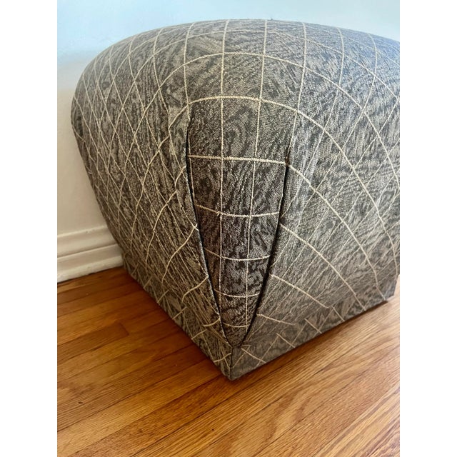 A vintage Marge Carson pouf, showcasing luxurious design and craftsmanship. This stylish pouf features premium upholstery...
