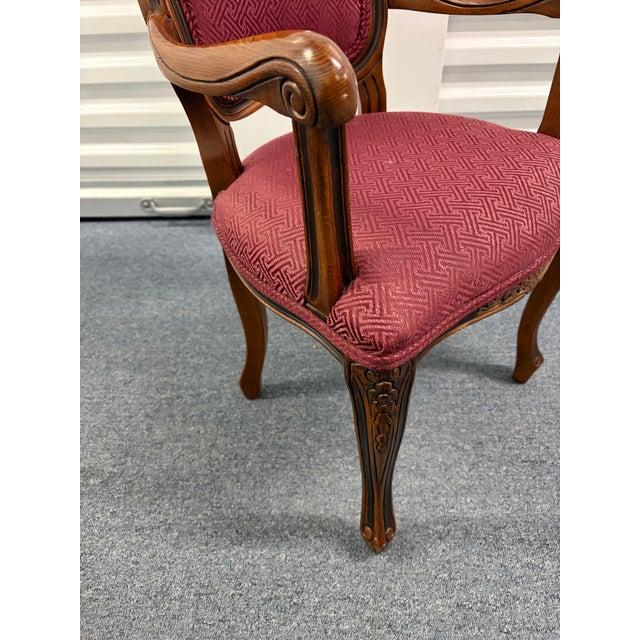 The chair in the images is a Louis XV style Bergere Child armchair . This type of elegant, carved wood chair is often a...