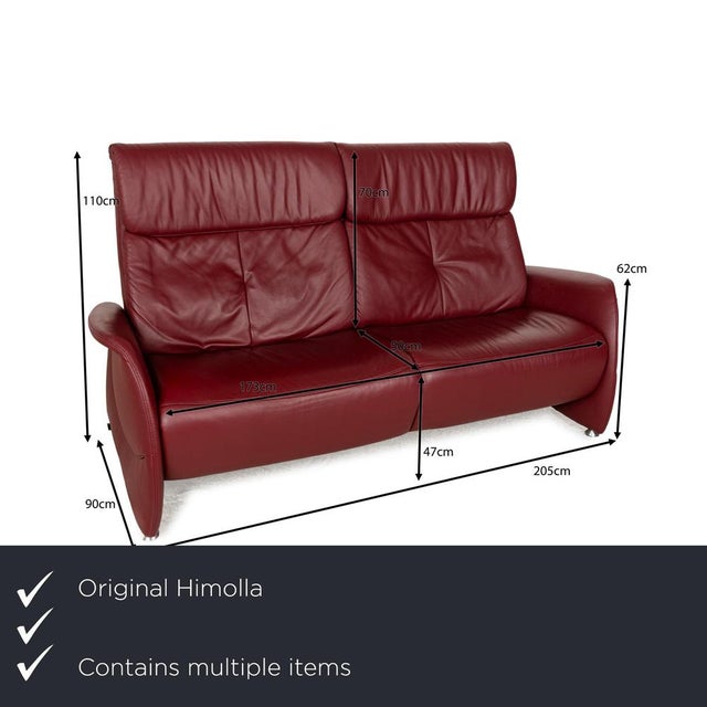 The Cumuly sofa set by Himolla, consisting of two identical three-seaters, is covered in dark red leather and stands on...