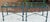 1980s Pair of Giacometti Style Wrought Iron Verdigris Finish Glass Top Side Table For Sale - Image 5 of 12