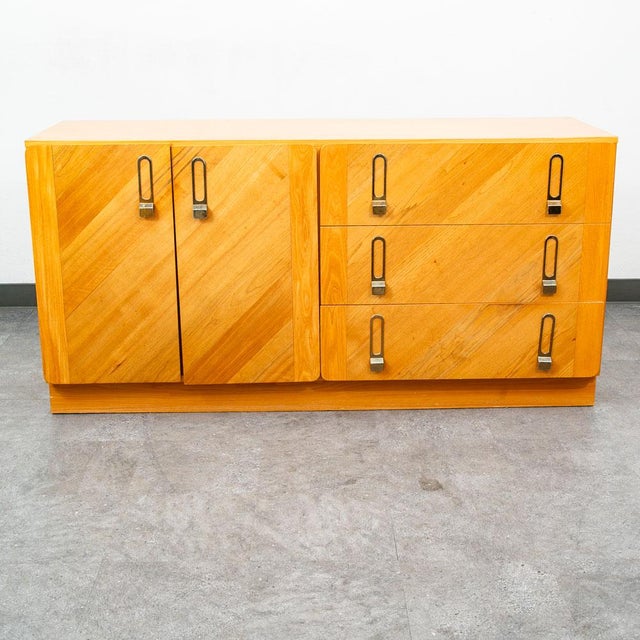 Canadian designed dresser / credenza with 6 total drawers. Unique sculpted drawer design with metal handles. Made in...