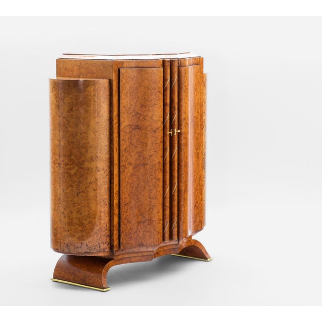 Fine Art Deco Amboyna Burr Table Cabinet. Circa 1930s. Of exceptional quality and notably rare, the cabinet has shaped...