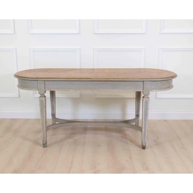 Made in France around 1900, this shop cutting table is constructed in painted wood with a herringbone-patterned top....