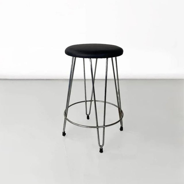 Modern Italian black leatherette and steel stool, ca. 1970. Stool with round upholstered seat covered in black...