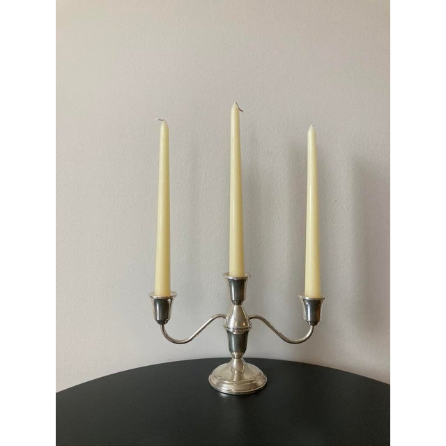 A beautiful shiny American sterling silver three arm candelabra for an elegant and traditional table setting. Candelabra...