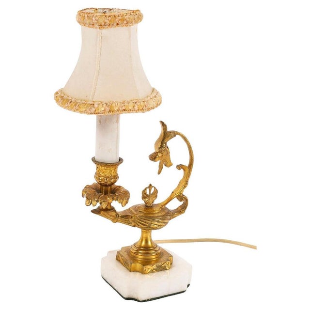 This is a splendid gilded ormolu marble base table lamp dating from the early 20th Century. Add an element of Classical...