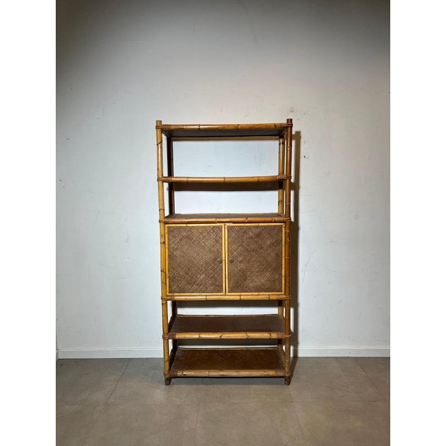 Beautiful vintage shelving cabinet in bamboo and woven rattan dating from the 1970s. A warm and airy piece with a strong...