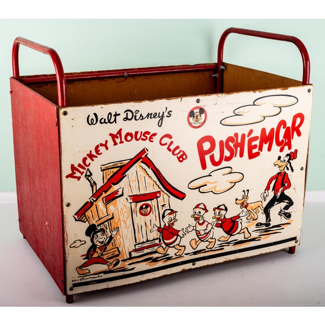An exceptional and highly collectible mid-century Walt Disney’s Mickey Mouse Club “Push ’Em Car” toy chest, featuring...