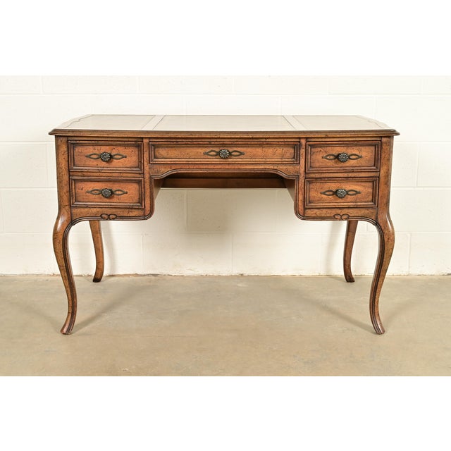 An exceptional French Provincial Louis XV style bureau plat writing desk By Sligh Furniture USA, Circa 1960s Carved...