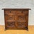 Characterful Spanish cabinet crafted in solid wood, featuring richly carved panels inspired by traditional Castilian...