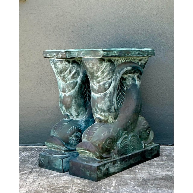 Elevate your interior with this commanding pair of vintage Neoclassical bronze dolphin pedestal bases. Inspired by the...