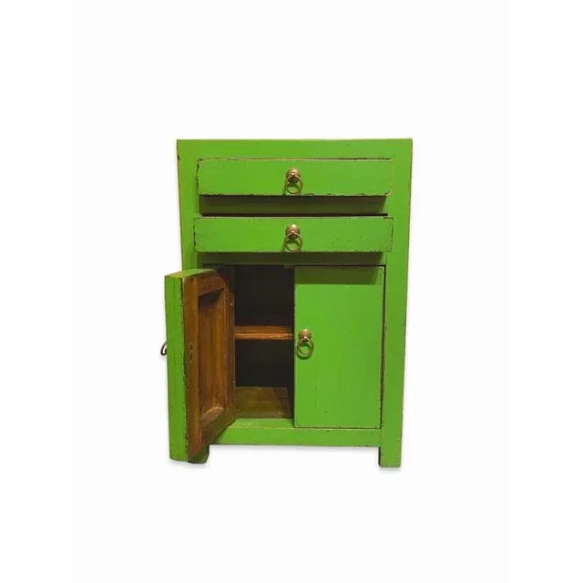 Asian South Shore End Table is made out of Elm wood. It has 2 drawers and 2 doors. It has a lot of storage, and can be use...