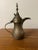 Vintage Turkish Coffee Pot with intricate hand carving. Marked on the bottom. Silver/tin/copper/brass. Diameter: 2.5”...