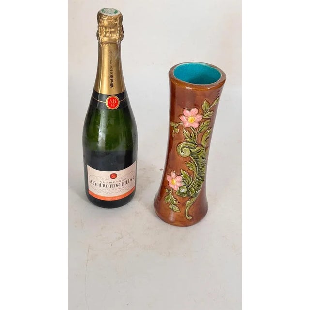 19th Century Majolica Vase with Floral and Foliage Motifs : This is a majolica vase dating from the 19th century, made in...