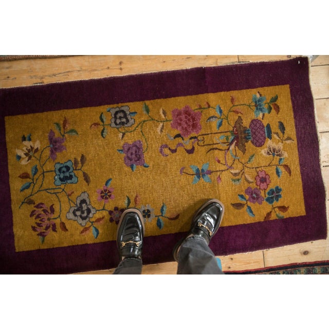 A stylized field presents an elegant, open composition framed by a defined border, allowing the central motifs to breathe....