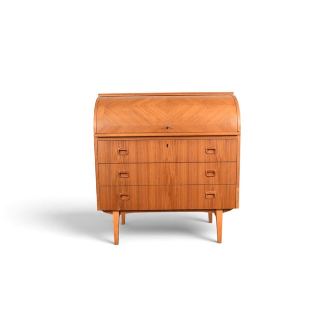 This secretary desk, with its distinctive curved top, was designed by Egon Östergaard and produced by Svensk Möbelindustri...