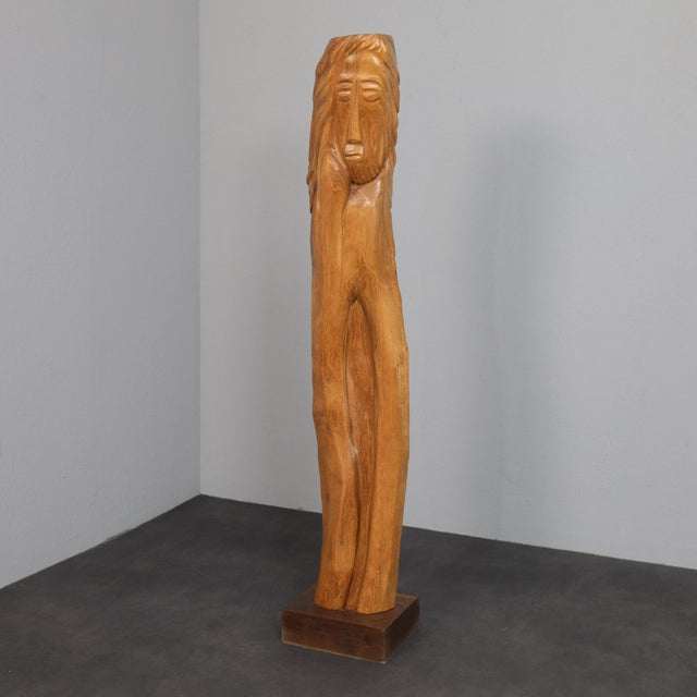 This monumental hand-carved sculpture, created in belgium during the 1970s, embodies a powerful sense of presence and...