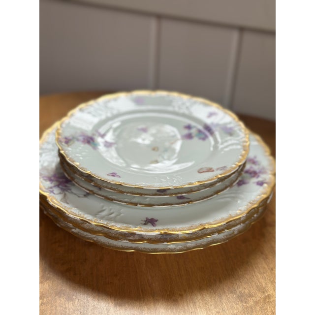 Six pieces of hand painted porcelain M. Redon French Limoges - three dinner plates and three salad plates in a violet...