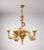 Carved giltwood five-arm chandelier executed in a Rococo Revival style. The body is richly ornamented with acanthus...