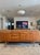 A beautiful teak sideboard by Stonehill Furniture, made in the UK, circa 1960s. It has gorgeous teak wood grain, sculpted...
