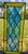 A striking vintage handcrafted leaded stained-glass architectural panel combining richly colored opalescent art glass with...