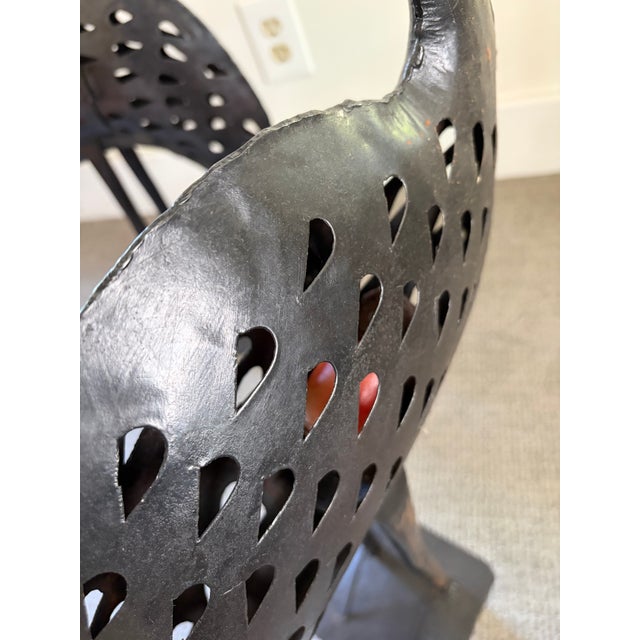 Very cool and unusual metal sculptures of flamingos that include a little door that opens for you to put a candle on the...