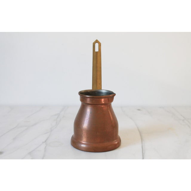 Vintage handmade copper cezve features a long brass handle for brewing traditional Turkish or Greek coffee. No makers...