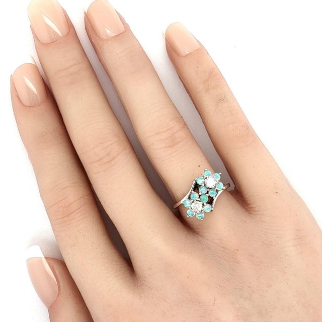 This lovely authentic double flower ring is crafted in solid 14k white gold with a polished finish and features two...