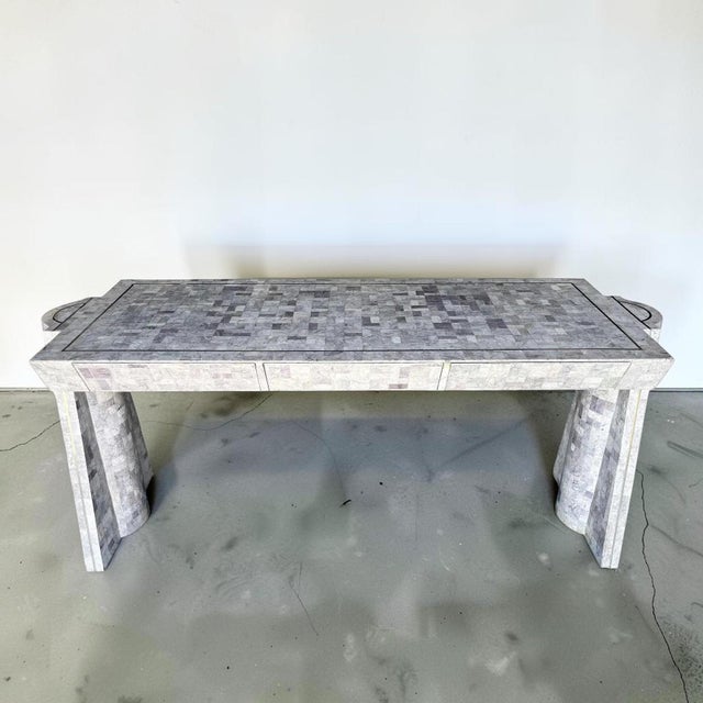 Jaw dropping tessellated marble, sculptural writing desk. This piece is made up of a purple/gray hue tessellated solid...