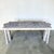 Jaw dropping tessellated marble, sculptural writing desk. This piece is made up of a purple/gray hue tessellated solid...