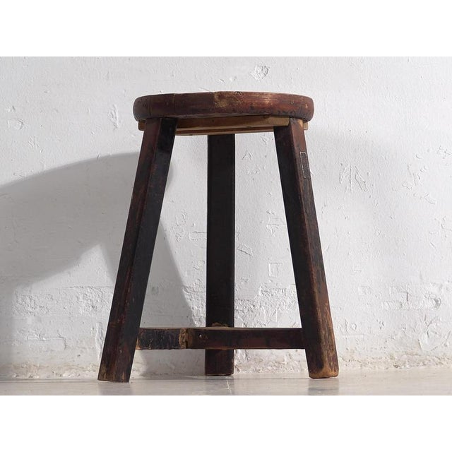 Antique dark colored round stool (c.1900) Dimensions: Diameter: 32 cm Height: 50 cm Style: Primitive Materials and...
