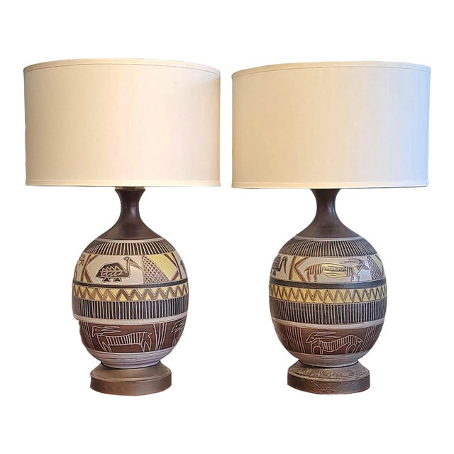 Pair of Table Lamps With African Style Animal Carvings For Sale