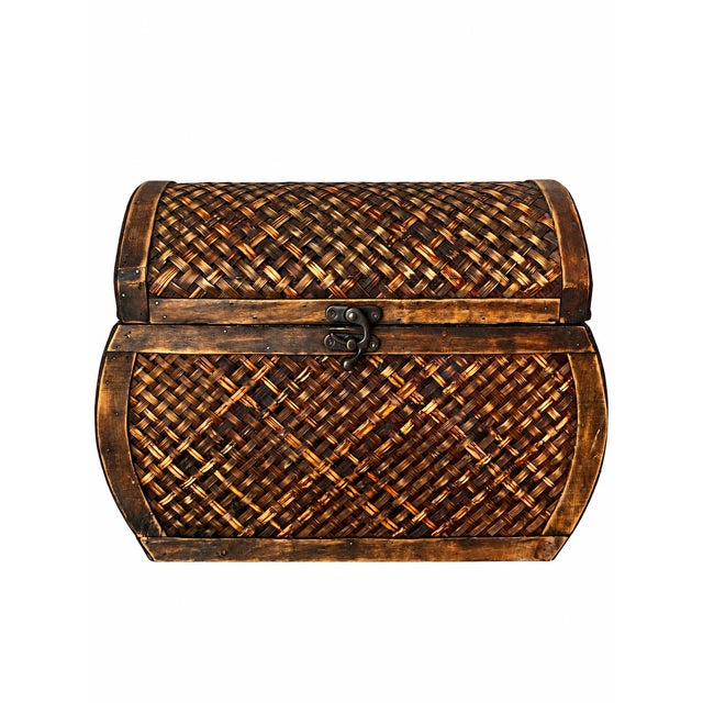 A decorative tabletop storage chest featuring a domed hinged lid, bowed front, and contrasting woven panels in honey,...
