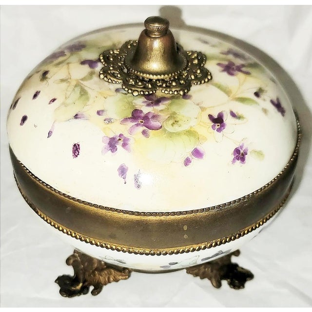 Few places in the world made porcelain on par with Limoges and this Wm Guerin hand painted porcelain covered compote jar...