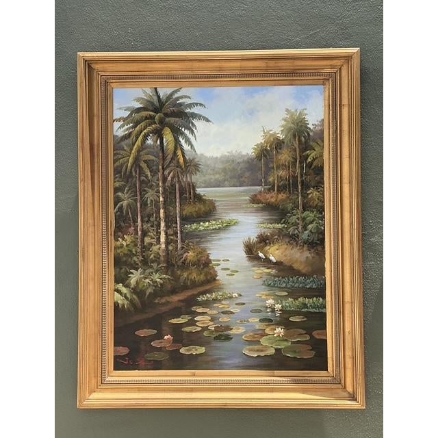 This monumental original oil painting on canvas captures the serene, wild beauty of a tropical wetland landscape, likely...