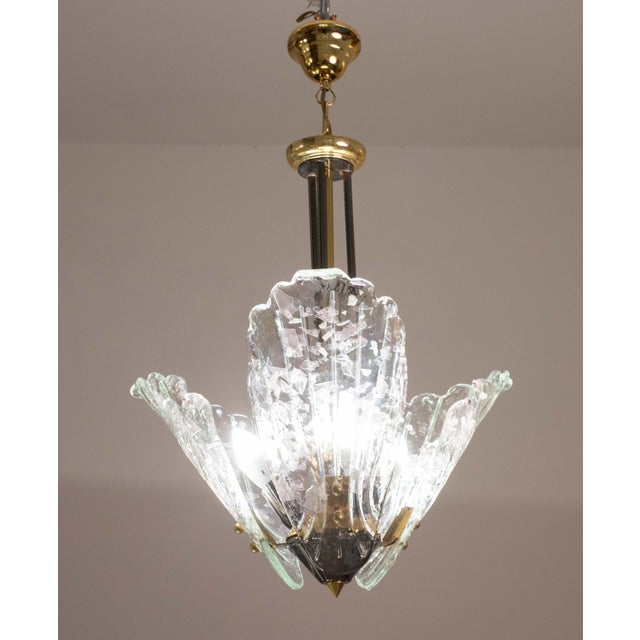 Elegant Murano chandelier with 3 murano glass leaves in iridiscent colour. The chain has been replaced, all glass is...