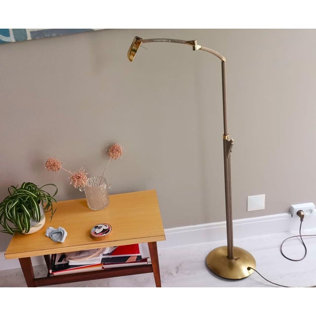Modernist articulate adjustable height and angle floor lamp, made of golden chromed metal. Estimated that it was designed...