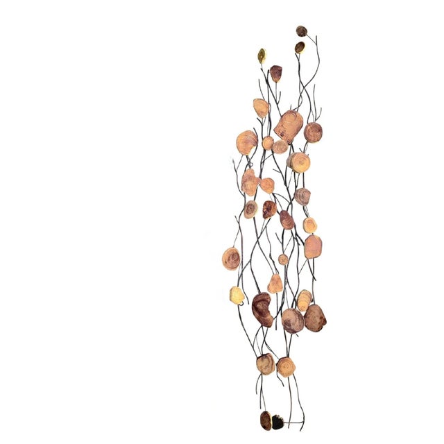A single organic MCM style tall metal and natural wood wall sculpture. The wall art consists of black metal branches with...