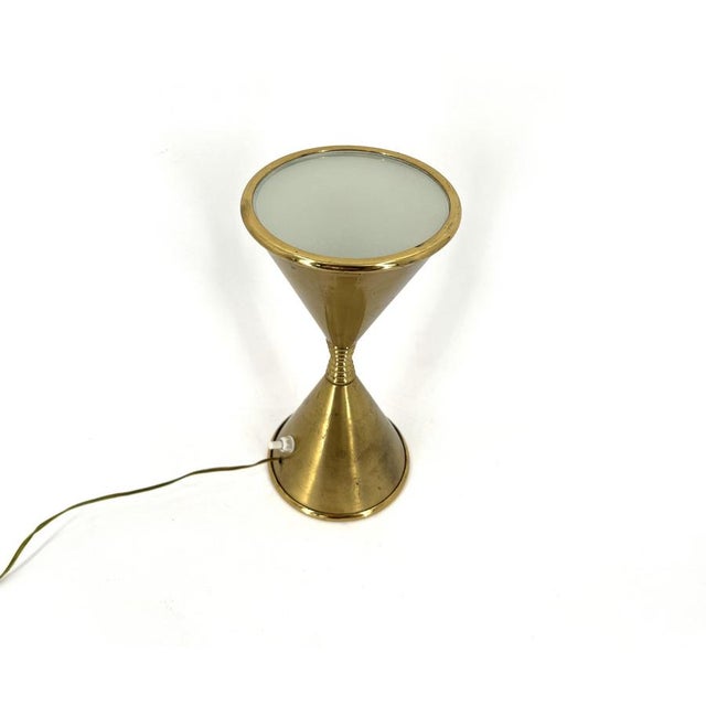 Very rare table lamp model Clessidra designed by Angelo Lelli and produced by Arredoluce in the 1960s. This diabolo shaped...