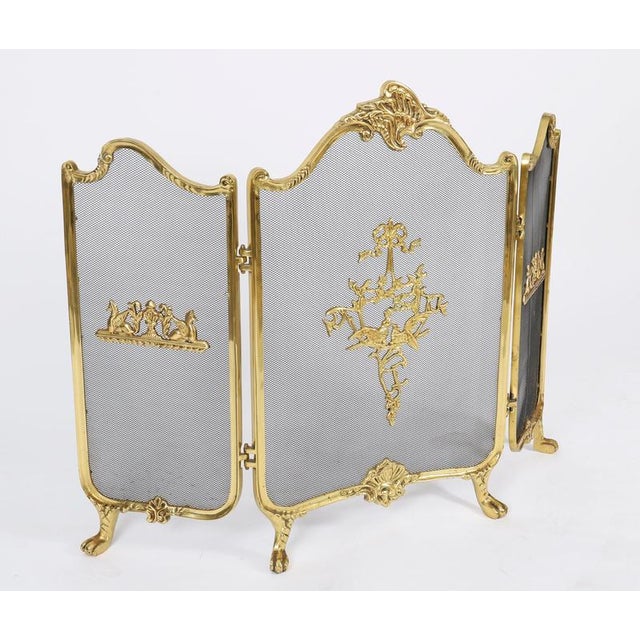 This is a superb and very decorative French Rococo revival ormolu and mesh fire-screen, circa 1870 in date. The shaped...