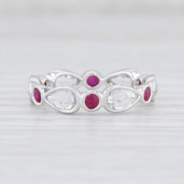 This lovely new ring is a Beverley K design. Gem: Natural Rubies - 0.49 Total Carats, Round Brilliant Cut, Red Color -...