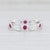 This lovely new ring is a Beverley K design. Gem: Natural Rubies - 0.49 Total Carats, Round Brilliant Cut, Red Color -...