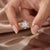 Radiating an ethereal glow, this starburst flower ring wraps a brilliant central stone in a halo of shimmering gems that...