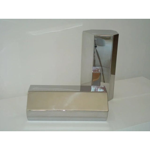 The French architect and artist Arik Levy mirror polish stainless steel small log sculptures from "Absent Nature" exhibit...